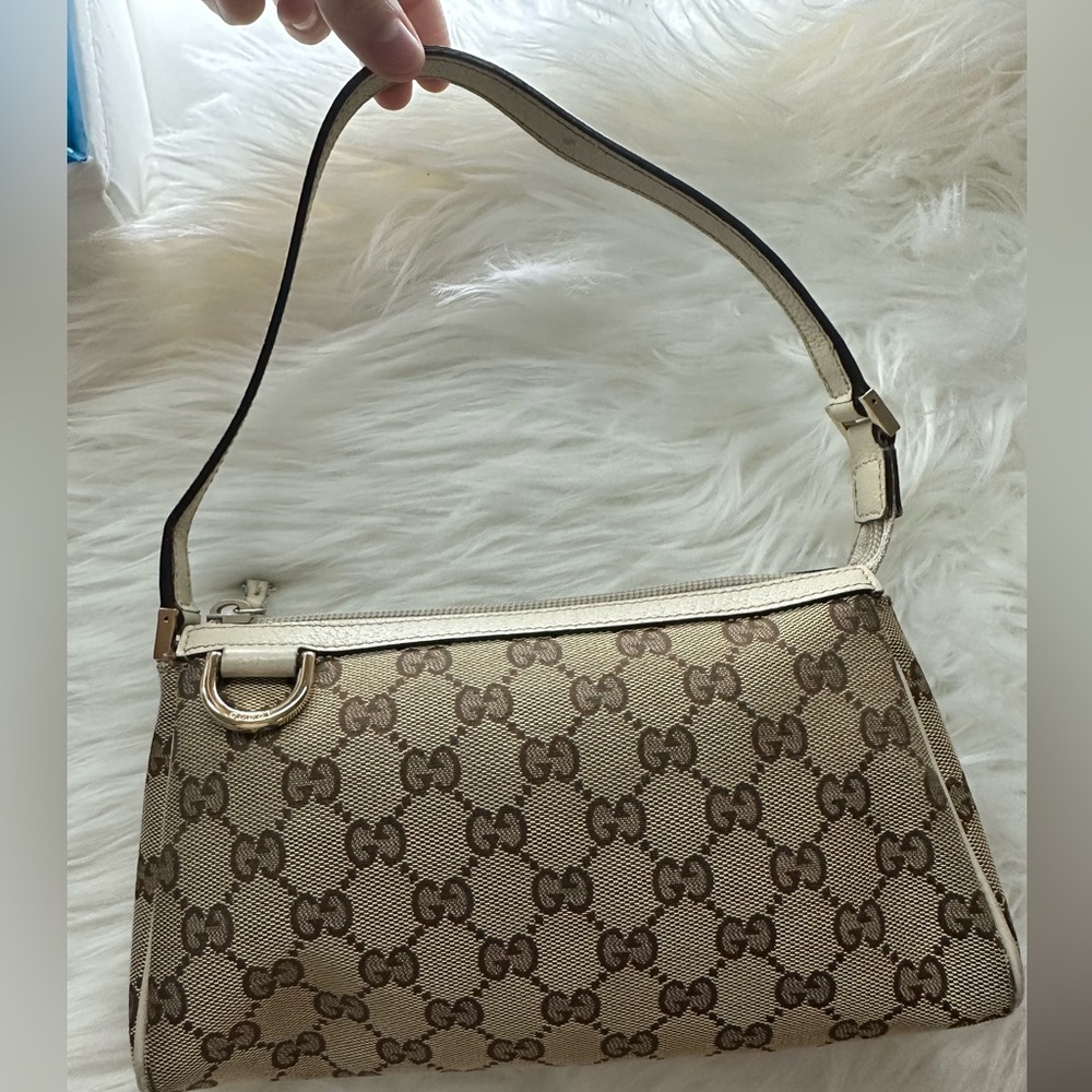 Authentic Gucci beige monogram pouchette